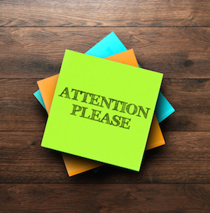 Image of Post-It note saying Attention Please