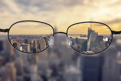 Image of glasses clarifying the New York skyline