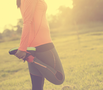 Image of a woman warming up before exercise