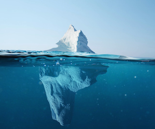 Image of iceberg with large portion hidden under water